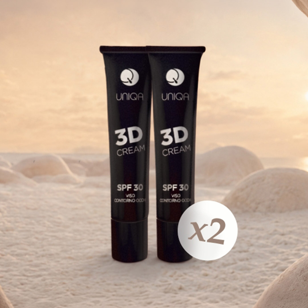 Due tubi di UNIQA 3D CREAM ambientati in un deserto onirico.